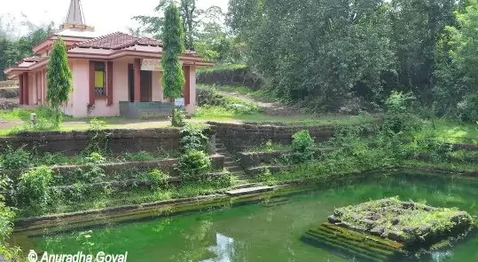 Panoramic view of the Bubbling Lake with a Temple in Netravali South Goa